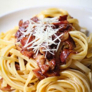 pasta with meat on white ceramic plate